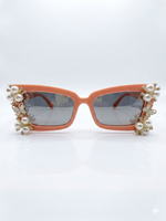 Pearls_are_Necessary_Sunglasses_with_arms_open_viewed_from_the_front